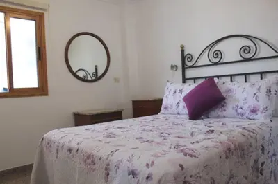 Cama o camas de una habitación en Céntrico Tinache by CASAS COCODRILO