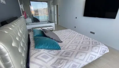 Cama o camas de una habitación en PENTHOUSE IN THE SEA, Tauro