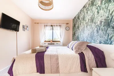 Cama o camas de una habitación en Home2Book Charming Apartment Playa del Inglés