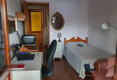 Una televisión o centro de entretenimiento en Alcaravaneras Home