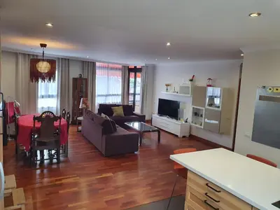 Una televisión o centro de entretenimiento en Alcaravaneras Home