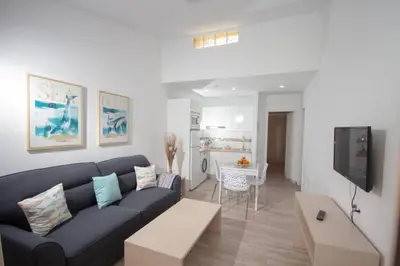 Zona de estar de Tisalaya - apartamento tranquilo con jardines y bicicletas