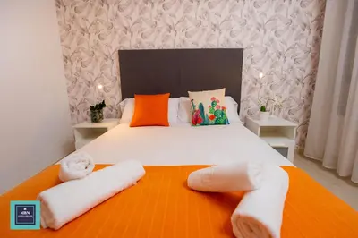 Cama o camas de una habitación en Maria Rosa Urban & Beach Apartment