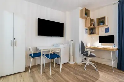 Una televisión o centro de entretenimiento en Studio La Puntilla