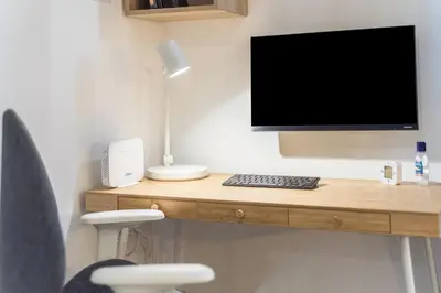 Una televisión o centro de entretenimiento en Studio La Puntilla