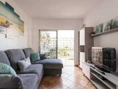 Una televisión o centro de entretenimiento en GuestReady - Tenesor 212 Playa del Inglés