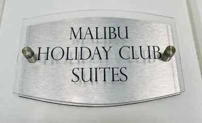Certificado, premio, señal o documento que está expuesto en THE MALIBU HOLIDAY CLUB SUITE - PUERTO RICO