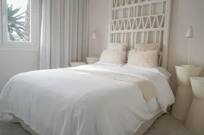 Cama o camas de una habitación en Agustino Beach Suites San Agustin