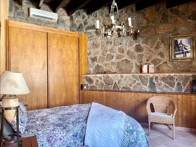 Cama o camas de una habitación en casa rural LA LIMERA con piscina privada