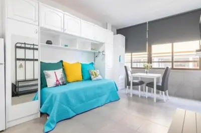 Cama o camas de una habitación en Estudio vacacional W&G Las Canteras con bonitas vistas al mar