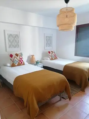 Cama o camas de una habitación en Beach Front Las Burras