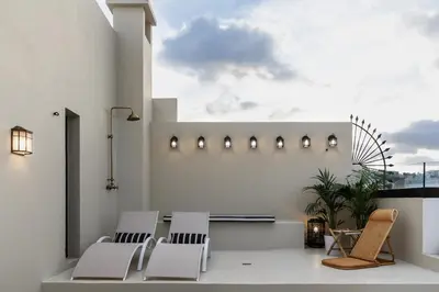 Un balcón o terraza de La Colonial Suites Apartamentos de Lujo