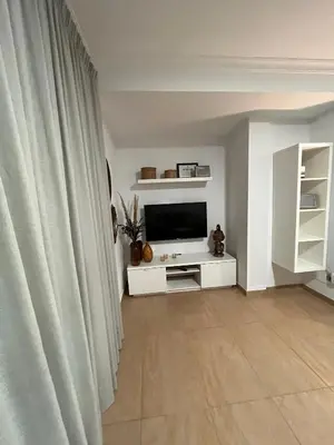 Una televisión o centro de entretenimiento en VV Janoa Playa Las Canteras 2