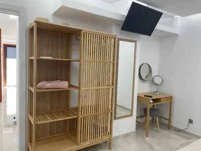 Una televisión o centro de entretenimiento en BAMBOO CHIC APARTMENT PLAYA DEL INGLES
