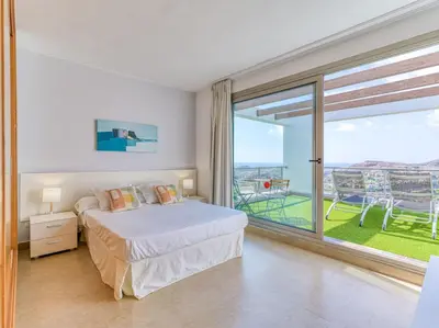 Cama o camas de una habitación en Salobre Villas Golfers