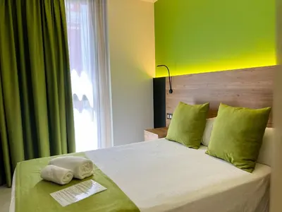 Cama o camas de una habitación en Hotel MG Poniente