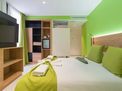 Cama o camas de una habitación en Hotel MG Poniente