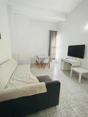 Una televisión o centro de entretenimiento en TABLERO 201, ACOGEDOR Apto 6 pax cerca PLAYA DEL INGLES
