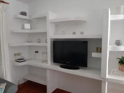 Una televisión o centro de entretenimiento en Bungalow Maspalomas, Campo Internacional