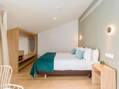 Cama o camas de una habitación en Hotel Emeté & Coworking by Airnest