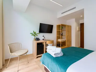Cama o camas de una habitación en Hotel Emeté & Coworking by Airnest