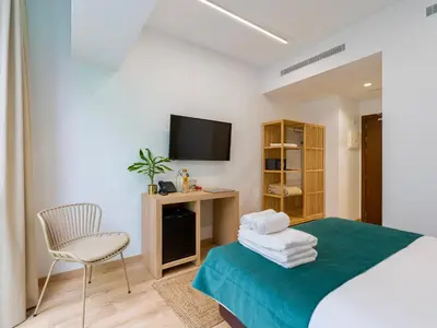 Cama o camas de una habitación en Hotel Emeté & Coworking by Airnest