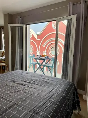Cama o camas de una habitación en Cosy Seaview Apartment Las Canteras