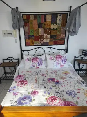 Cama o camas de una habitación en Ático Arinaga con vistas , jacuzzi , terraza y barbacoa