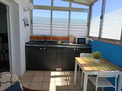 Una cocina o zona de cocina en Ático Arinaga con vistas , jacuzzi , terraza y barbacoa