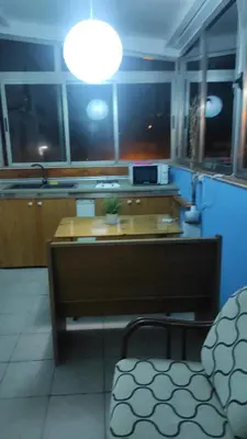 Zona de estar de Ático Arinaga con vistas , jacuzzi , terraza y barbacoa