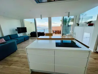 Una cocina o zona de cocina en OvertheOcean Big terrace and XL Bed