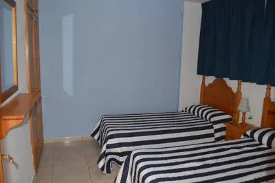 Cama o camas de una habitación en Apartamentos Teror - Gavias del Sol