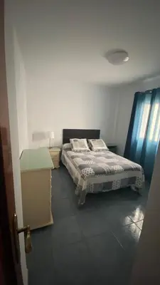 Cama o camas de una habitación en Apartamento Islas Malvinas 39