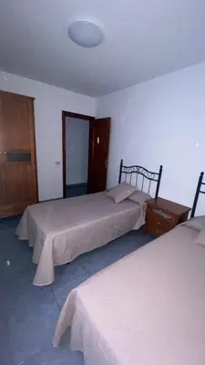 Cama o camas de una habitación en Apartamento Islas Malvinas 39