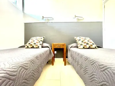 Cama o camas de una habitación en Apartamento vacacional sur de Gran Canaria, segunda linea de playa con wifi