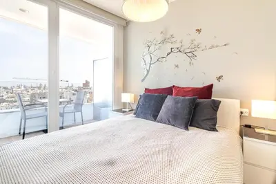 Cama o camas de una habitación en Brand New Apartment with Ocean & Volcano Views