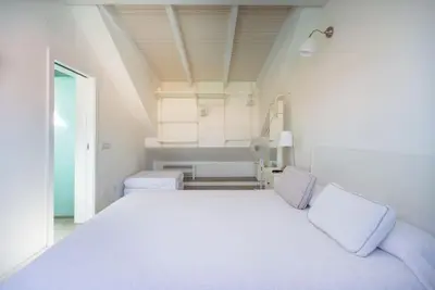 Cama o camas de una habitación en FABULOUS BUNGALOW , WIFI, SWIMMING POOL AND BEACH
