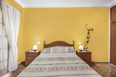 Cama o camas de una habitación en Solarium Agaete Valley Retreat 3-BR