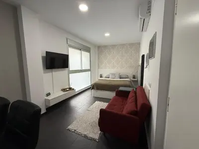 Una televisión o centro de entretenimiento en Apolo Studio: Apartamento en Playa de Las Canteras