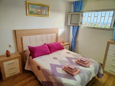 Cama o camas de una habitación en Residencial Los Molinos con piscina, TV internacional y Wifi