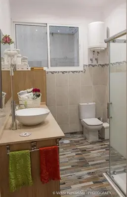 Un baño de Living House