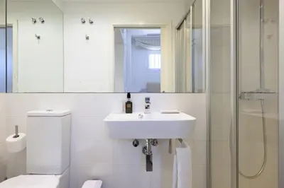 Un baño de FaroVela Suites Pasito Blanco