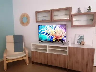 Una televisión o centro de entretenimiento en CANTERAS NICE BEACH. Holiday Home.2Bdrm.