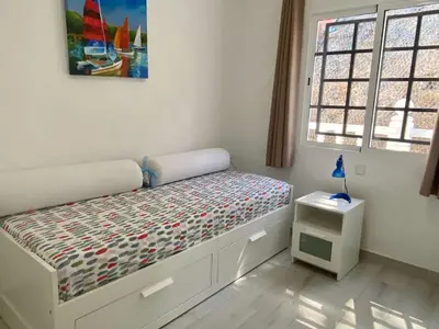 Cama o camas de una habitación en Casa Aita - refurbished apartment with unparalleled sea view