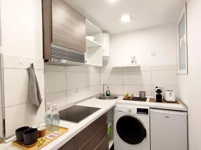Una cocina o zona de cocina en Las Canteras Suite