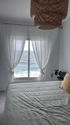 Cama o camas de una habitación en Cá Xuxù Precioso ático en primera línea de mar