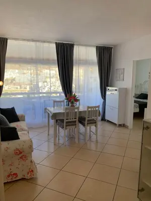 Zona de estar de Appartamento confortevole con piscina 7