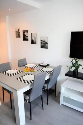 Una televisión o centro de entretenimiento en PALMENGARTEN APARTMENT Los Molinos
