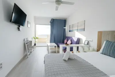 Cama o camas de una habitación en Moderno Estudio con terraza en Las Canteras
