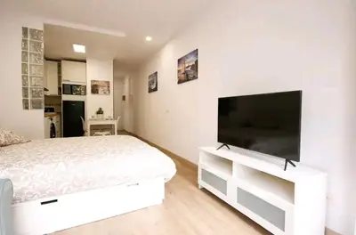 Una televisión o centro de entretenimiento en Apartamento Las Palmas